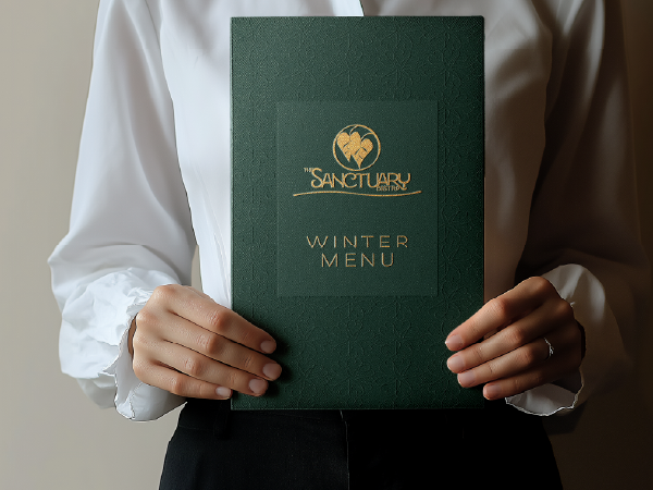 Sanctuary Bistro winter menu cover design in deep green and gold