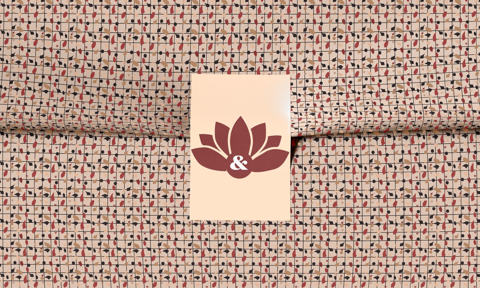 Terrazzo-patterned tissue paper with a cream Willow & Blossom card centered on top